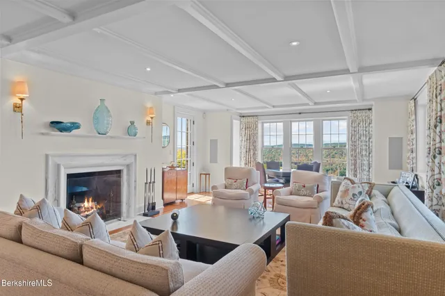 a spacious bedroom with a bed and a large window