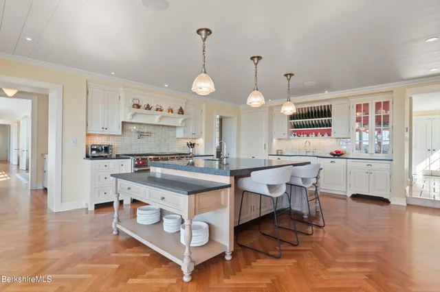 a room with table chairs and window