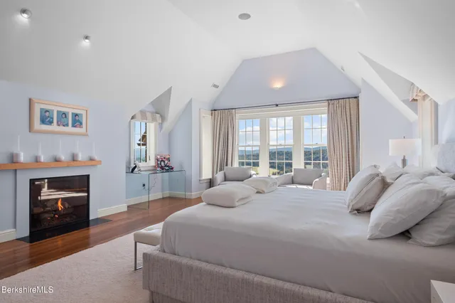 a view of a lake with green field