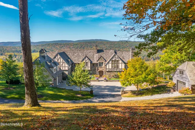 a large kitchen with stainless steel appliances granite countertop a lot of counter space