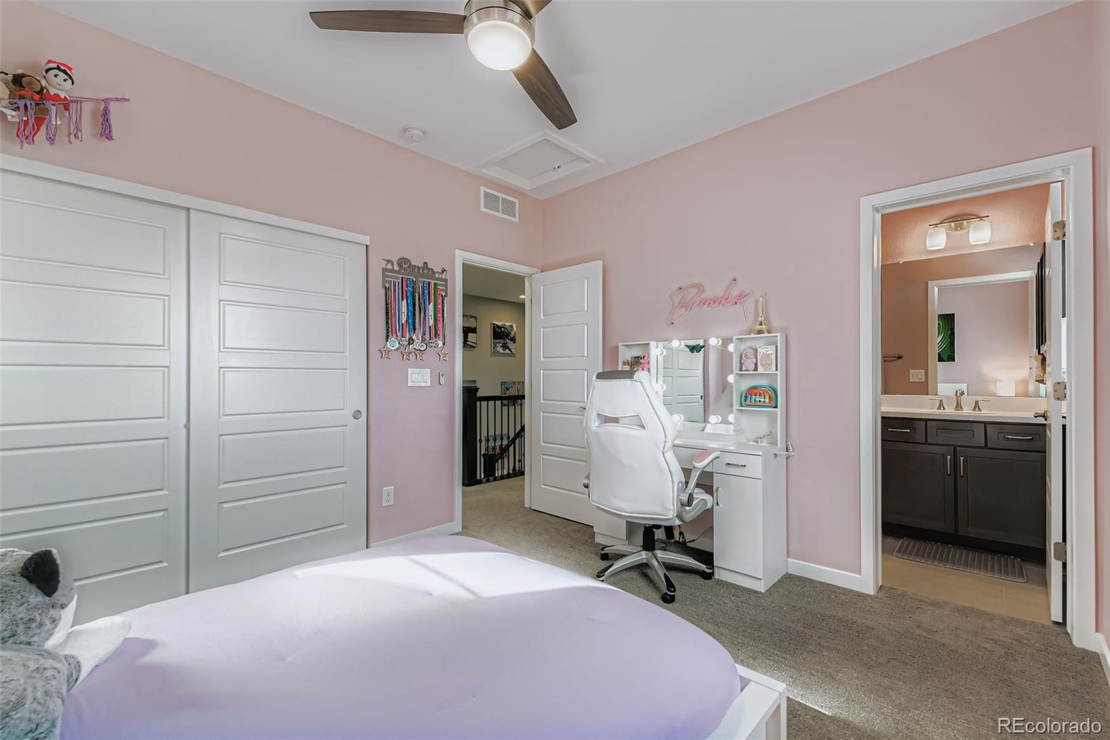 86 Nova Court Erie, CO 80516 - Photo 20 of 50 a bedroom with a bed and a desk