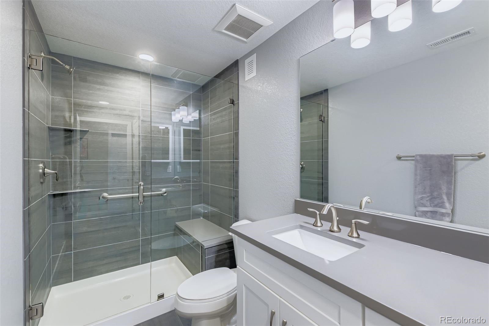 86 Nova Court Erie, CO 80516 - Photo 31 of 50 a bathroom with a sink a toilet and shower