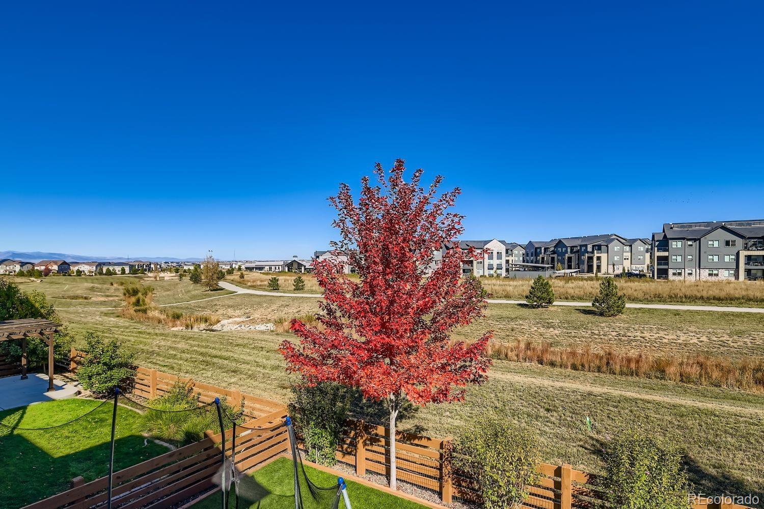 86 Nova Court Erie, CO 80516 - Photo 40 of 50 a view of a lake with a building in the background