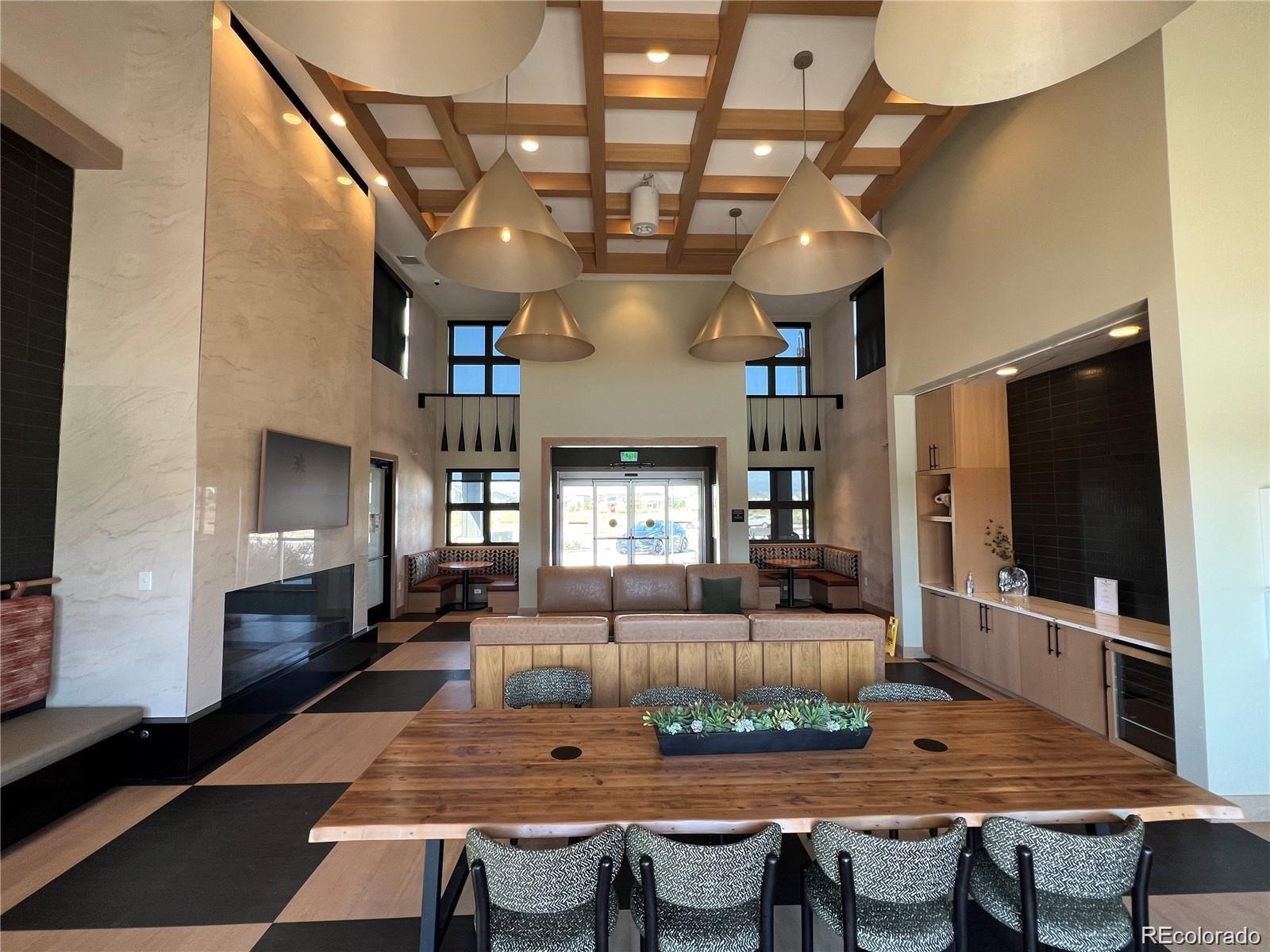 86 Nova Court Erie, CO 80516 - Photo 49 of 50 a view of a dining room with furniture a chandelier and wooden floor
