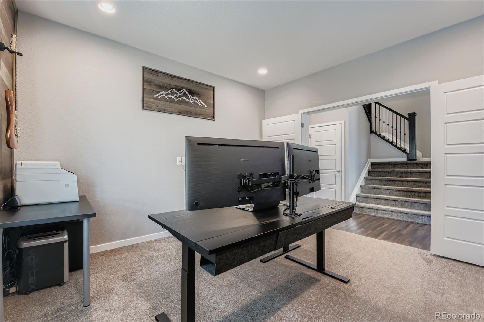 86 Nova Court Erie, CO 80516 - Photo 6 of 50 a view of a livingroom with furniture and wooden floor