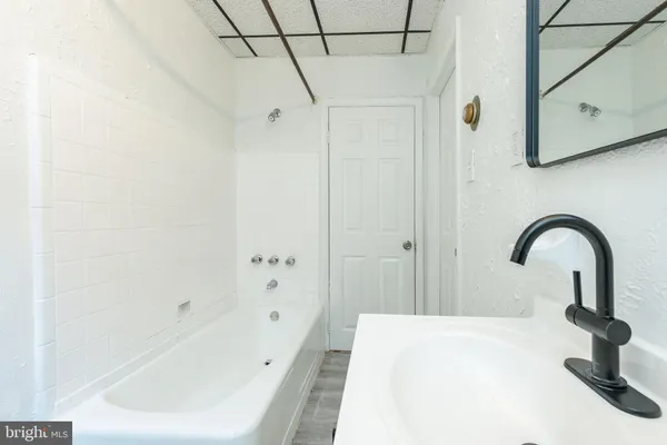 a bathroom with a sink and a bathtub