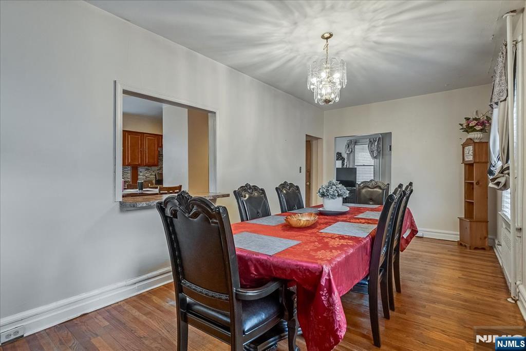 15 Belle Terre Road West Orange, NJ 07052 - Photo 11 of 29 a view of a dining room with furniture and wooden floor