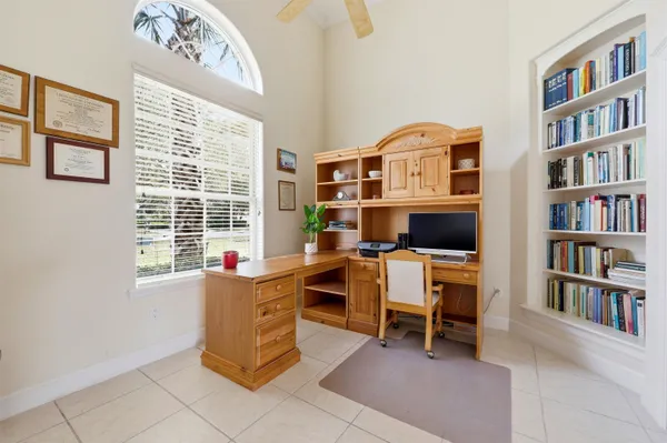 a kitchen with cabinets oven and a window