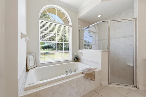 a white bath tub sitting next to a window