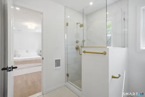 a bathroom with a shower and a sink