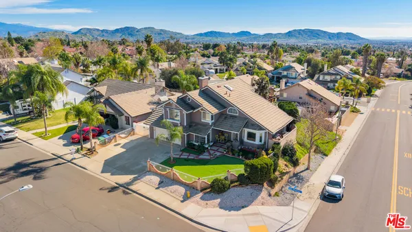 an aerial view of a house with a garden