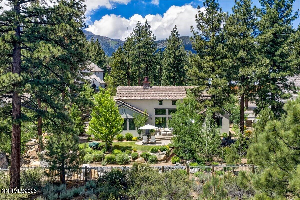 5096 Bordeaux Court Reno, NV 89511 - Photo 65 of 70 a view of a house with a tree park plants and large trees