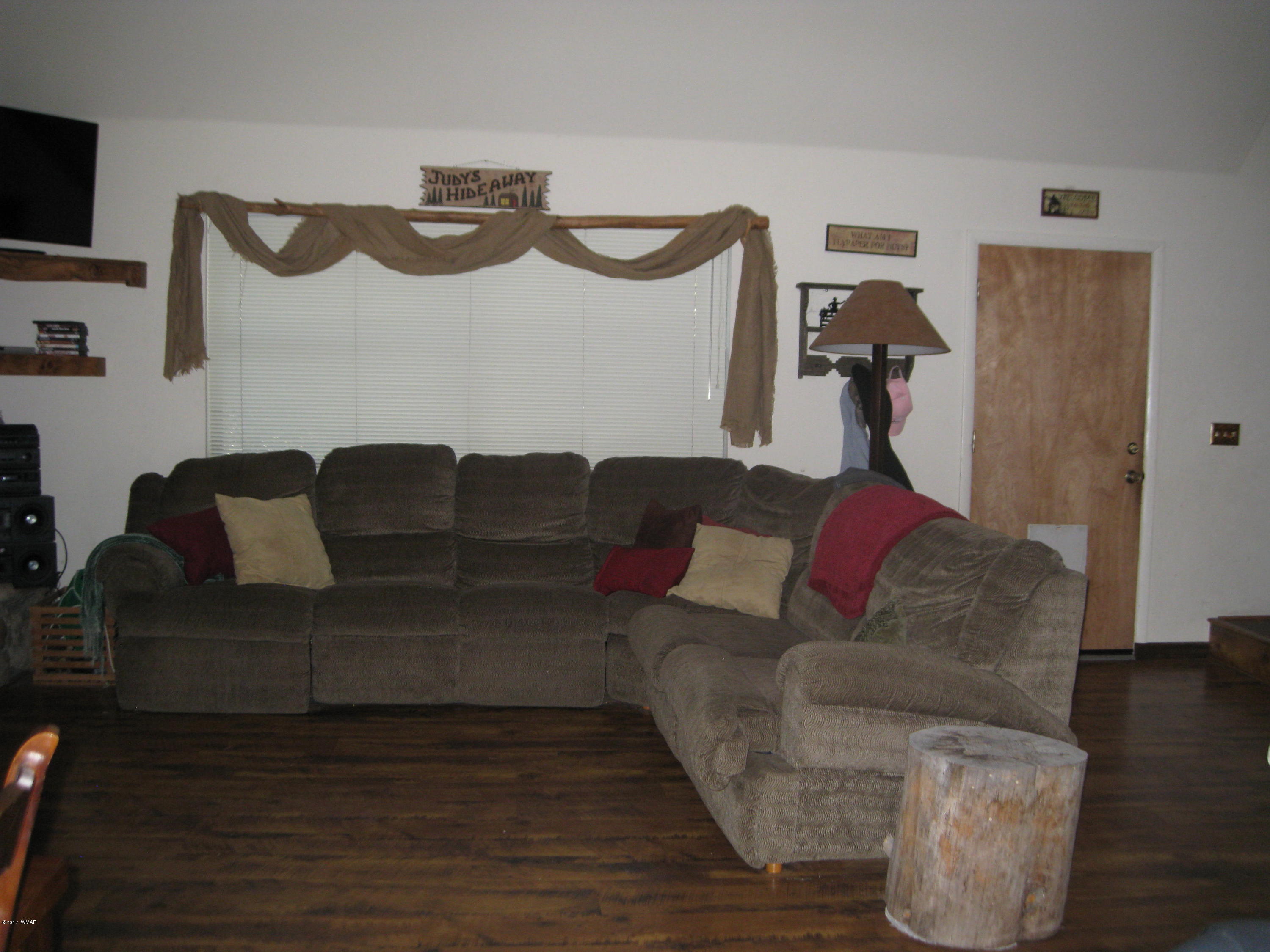 2910 Red Cinder Road Heber, AZ 85928 - Photo 4 of 27 a living room with furniture and a wooden floor