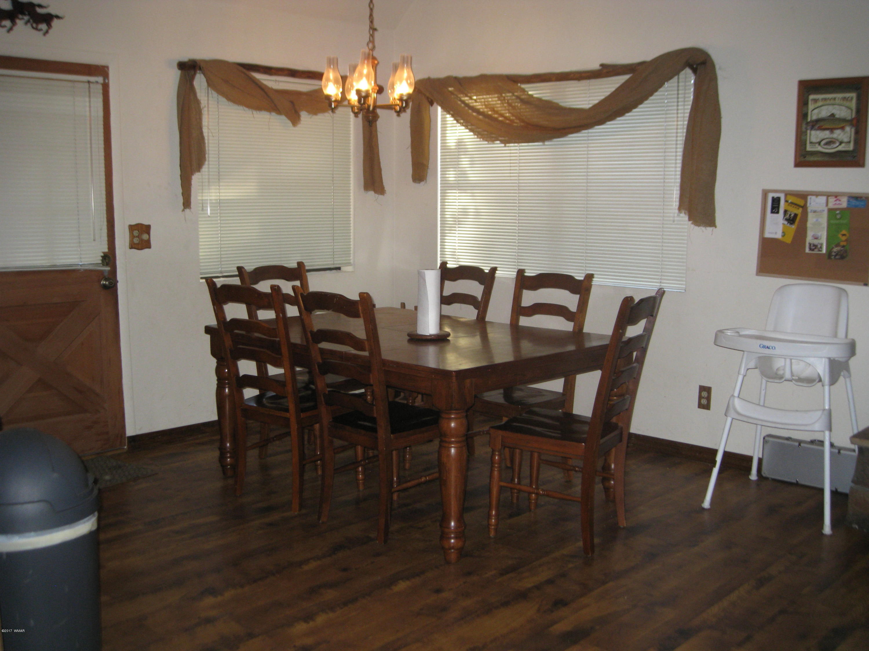 2910 Red Cinder Road Heber, AZ 85928 - Photo 10 of 27 a view of a dining room with furniture and wooden floor