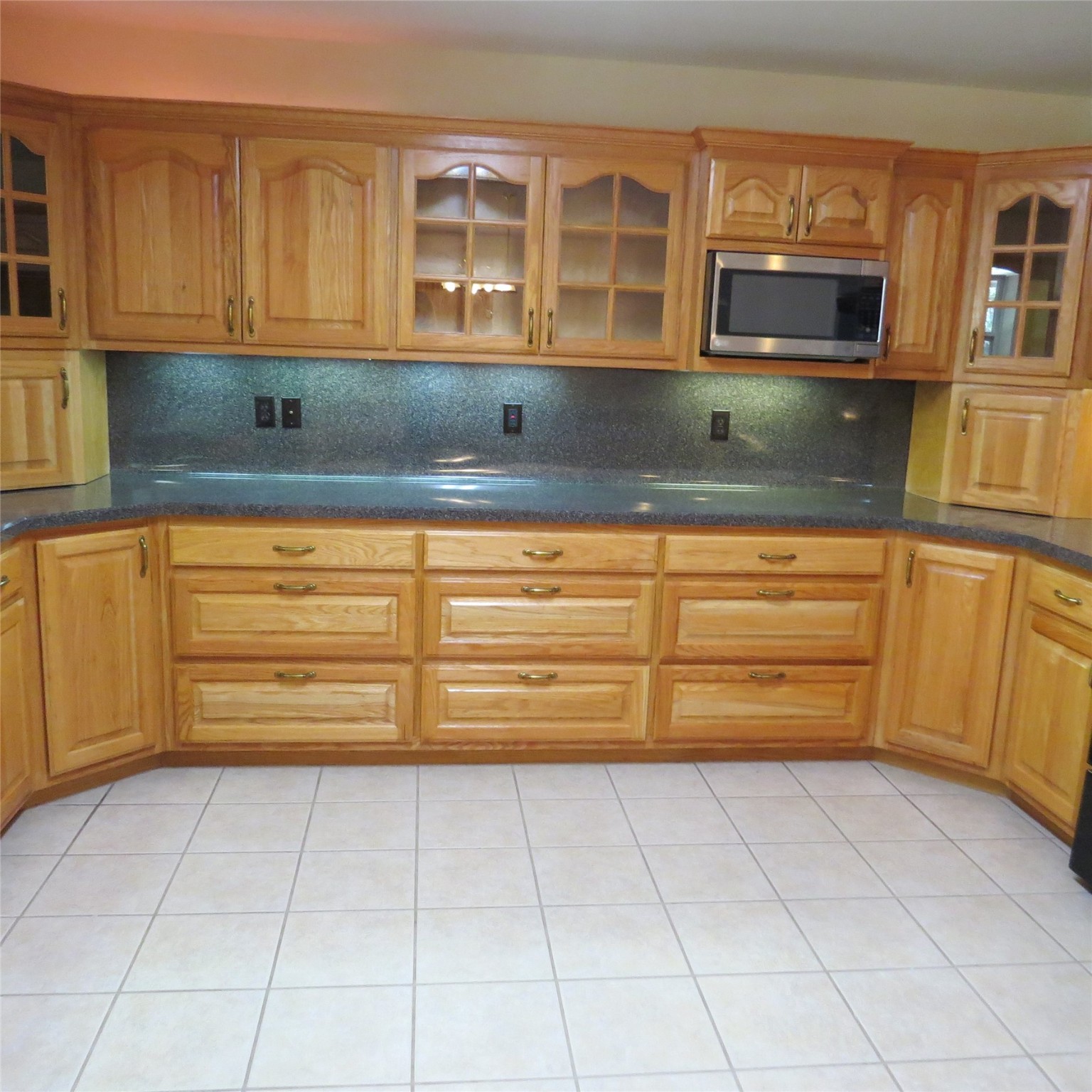 651 Sam Houston Loop Point Blank, TX 77364 - Photo 12 of 47 a kitchen with granite countertop a stove and cabinets