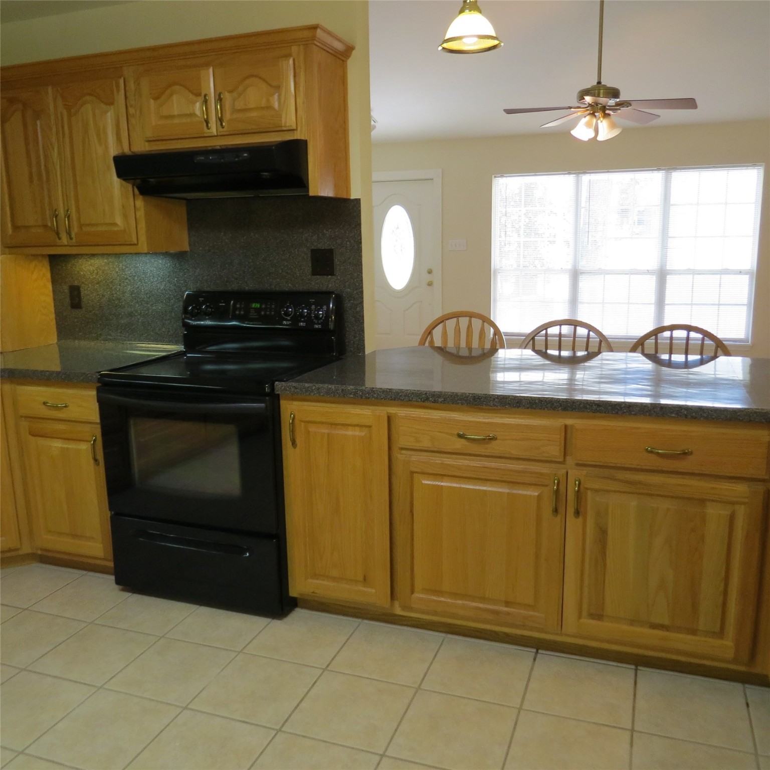 651 Sam Houston Loop Point Blank, TX 77364 - Photo 13 of 47 a kitchen with granite countertop a sink and a stove