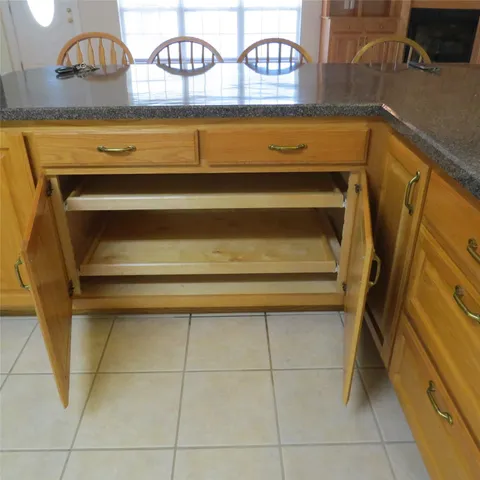 a kitchen with a sink and a stove