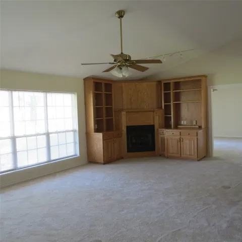 a view of a room that has a table and chairs