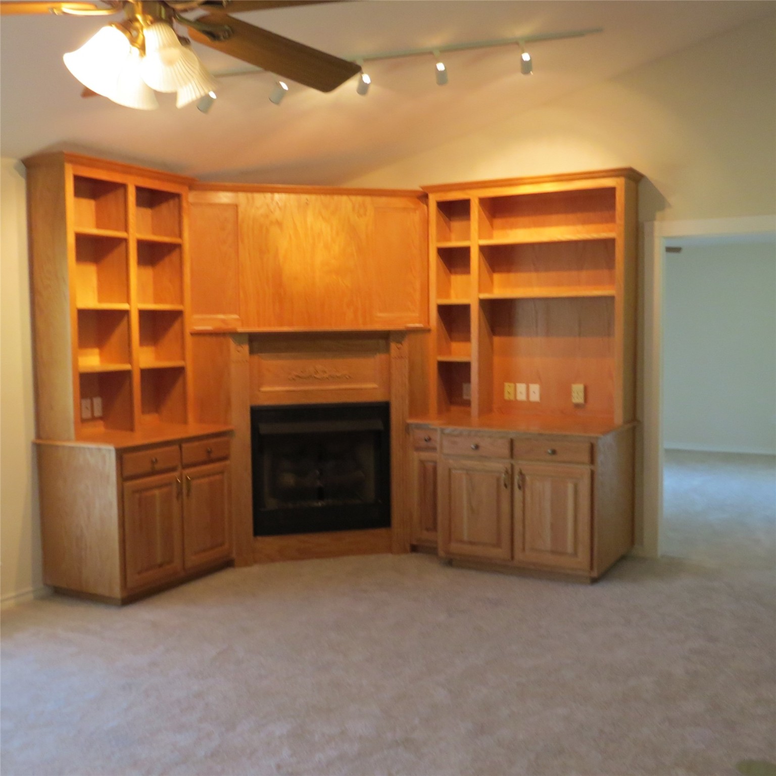 651 Sam Houston Loop Point Blank, TX 77364 - Photo 20 of 47 a view of an empty room with a fireplace and a window