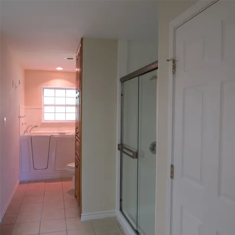 a bathroom with a granite countertop toilet a sink and bathtub