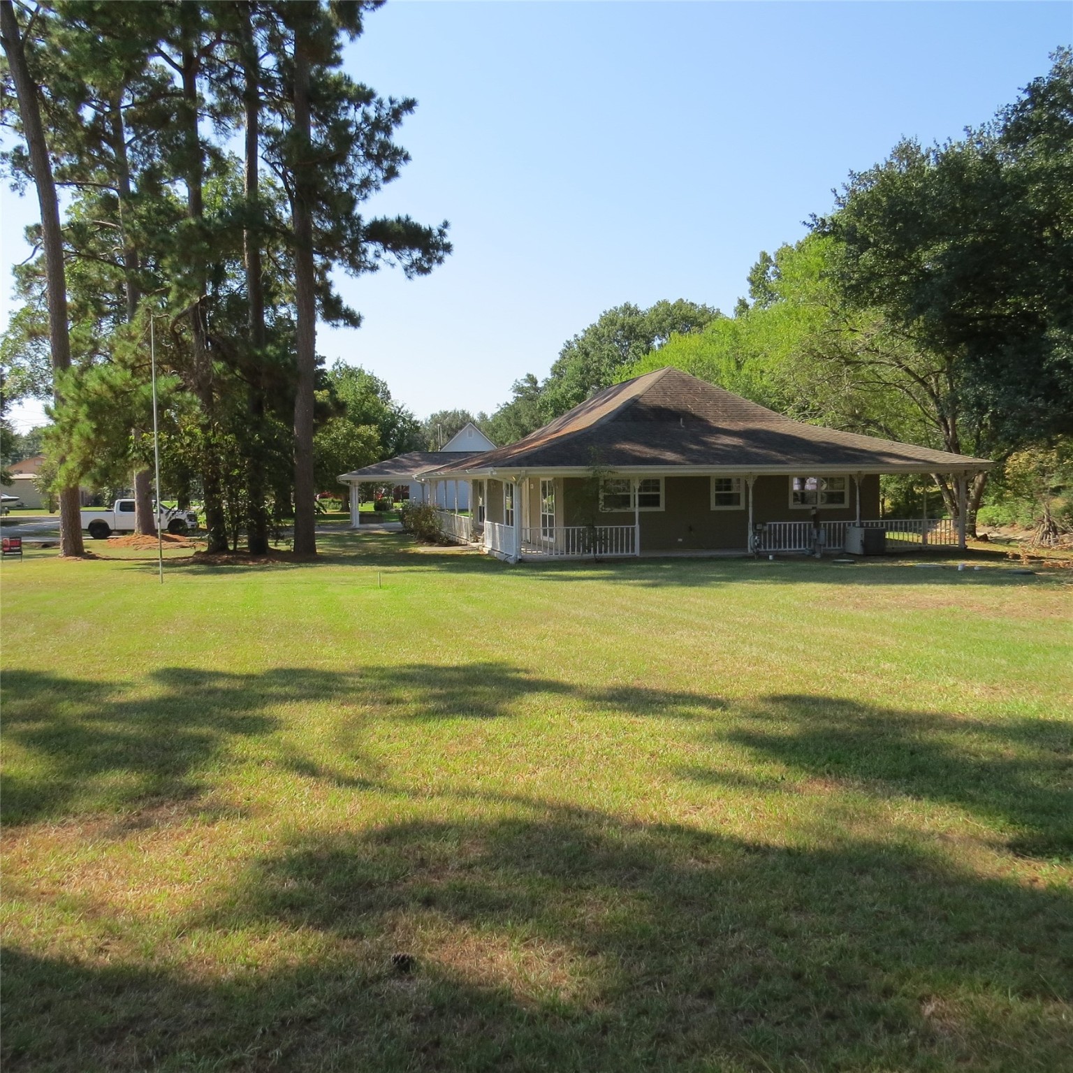 651 Sam Houston Loop Point Blank, TX 77364 - Photo 3 of 47 a view of a swimming pool with lawn chairs and plants
