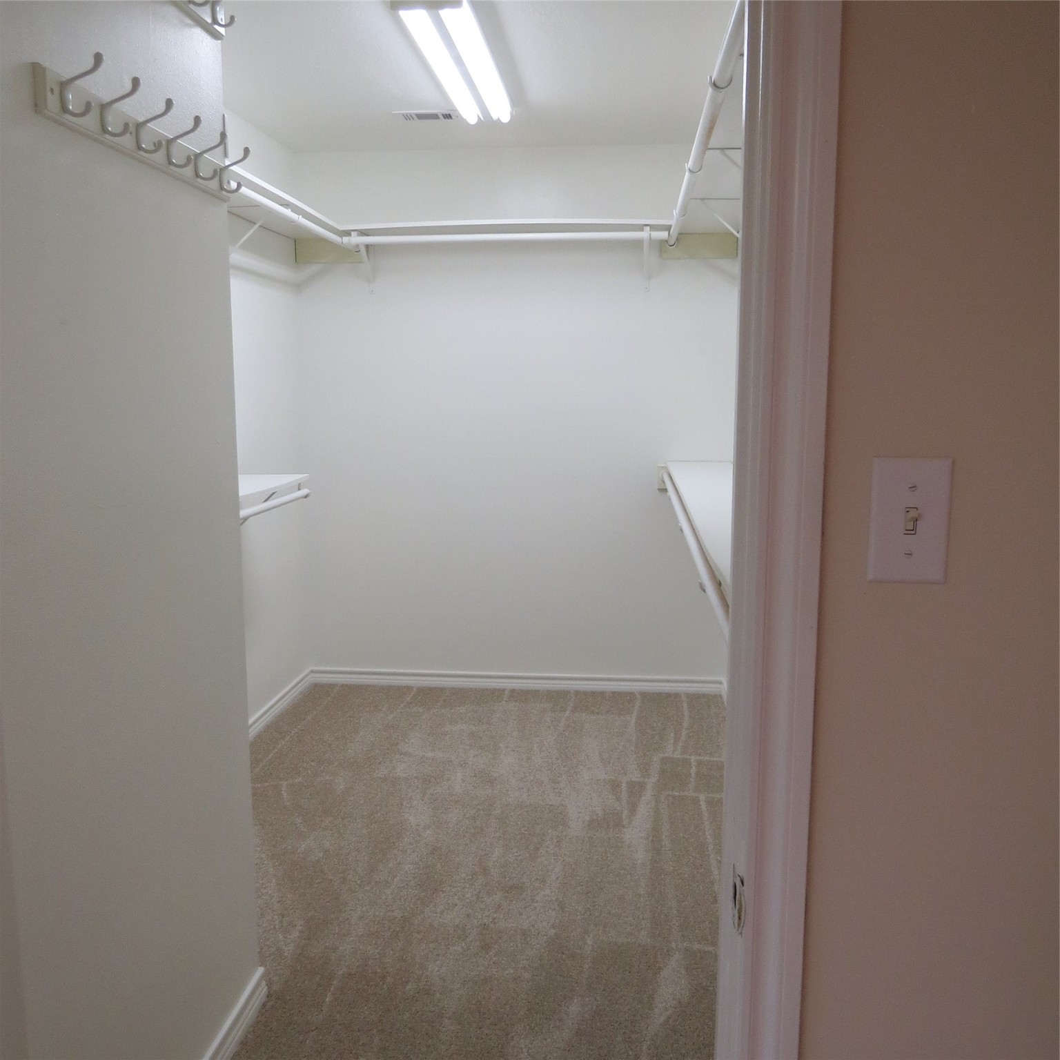 651 Sam Houston Loop Point Blank, TX 77364 - Photo 31 of 47 Very large primary bedroom closet off of the primary bath