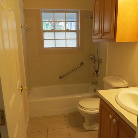 a view of lawn chairs and an ocean view