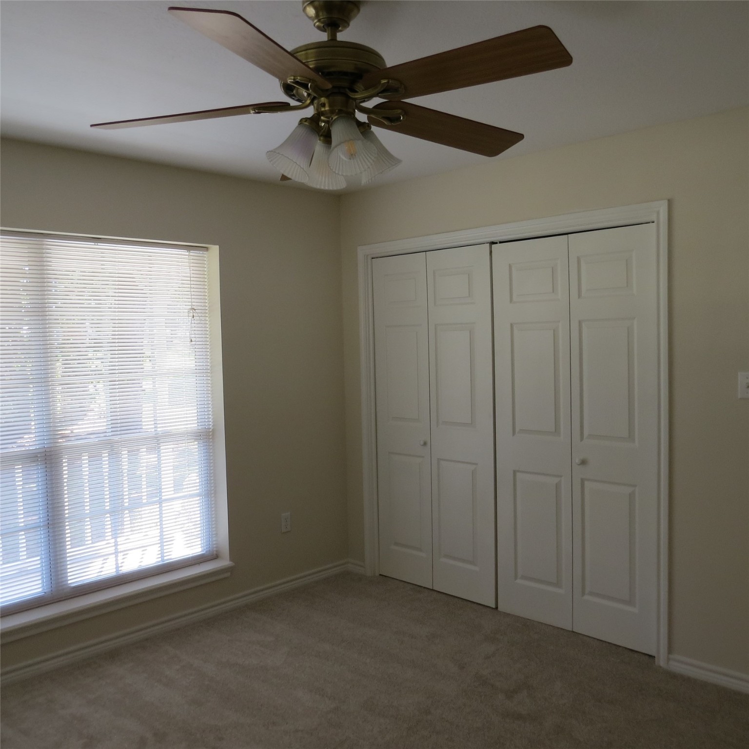 651 Sam Houston Loop Point Blank, TX 77364 - Photo 36 of 47 an empty room with a window and a fan