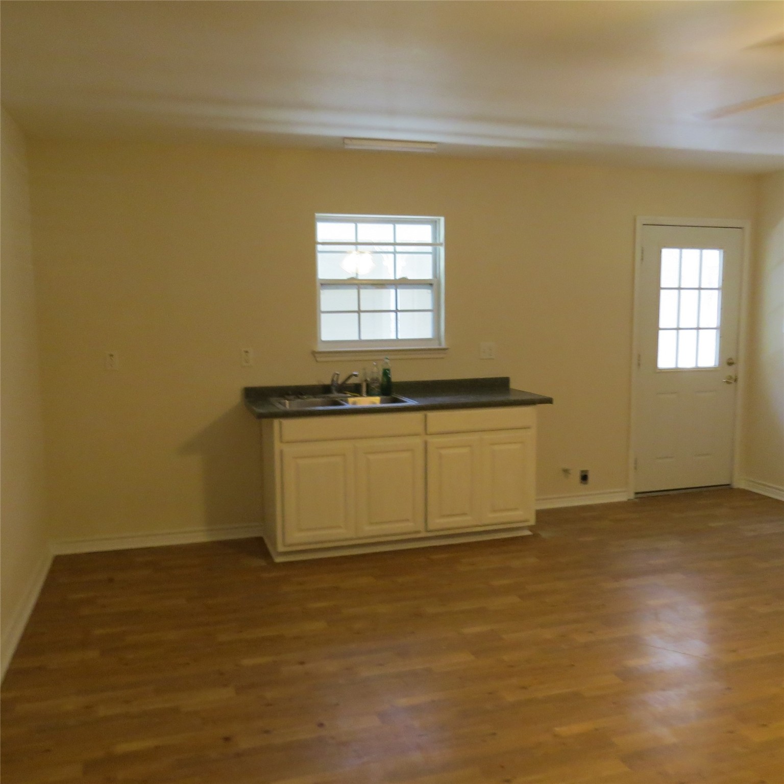 651 Sam Houston Loop Point Blank, TX 77364 - Photo 42 of 47 a view of a kitchen with wooden floor and a window