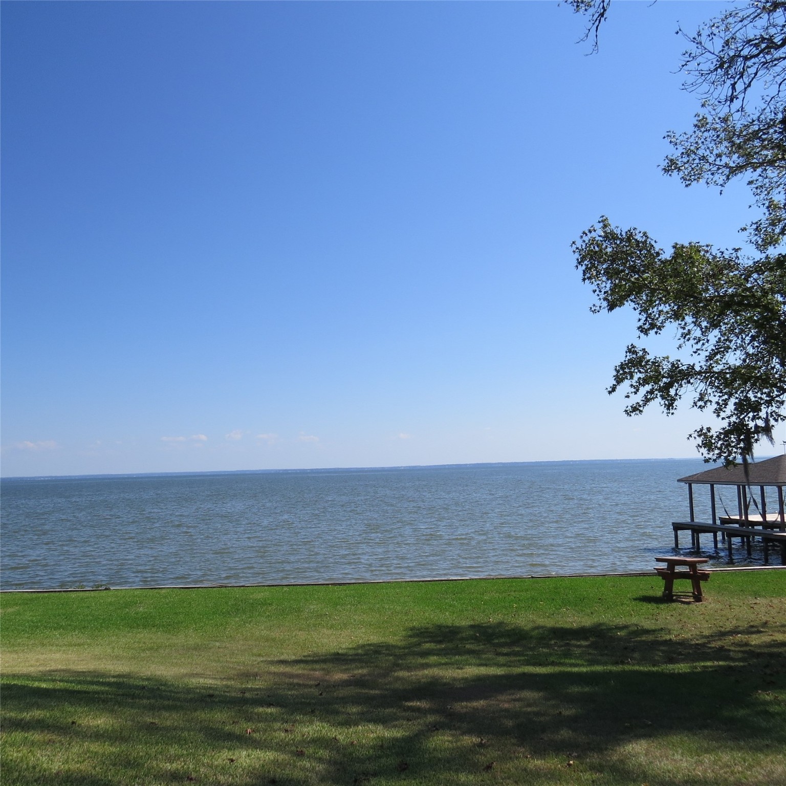 651 Sam Houston Loop Point Blank, TX 77364 - Photo 43 of 47 a view of lawn chairs and an ocean view