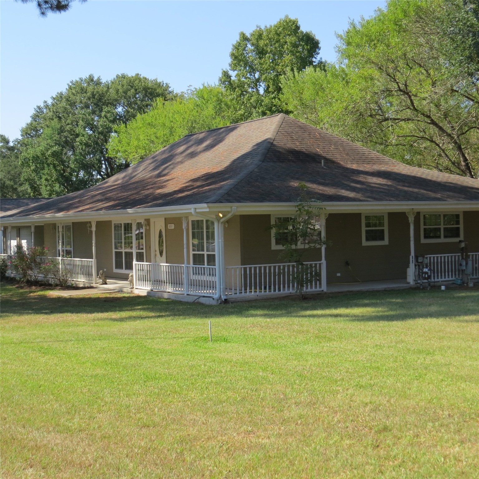 651 Sam Houston Loop Point Blank, TX 77364 - Photo 5 of 47 a view of a house with a yard