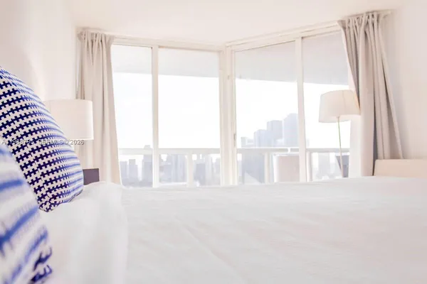 a view of an empty room and a window