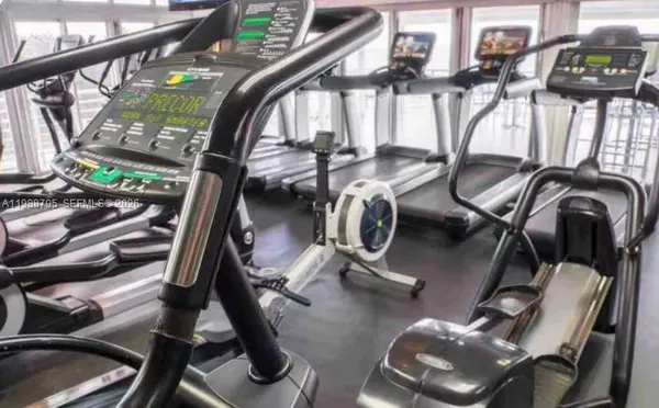 a view of a swimming pool with sitting area