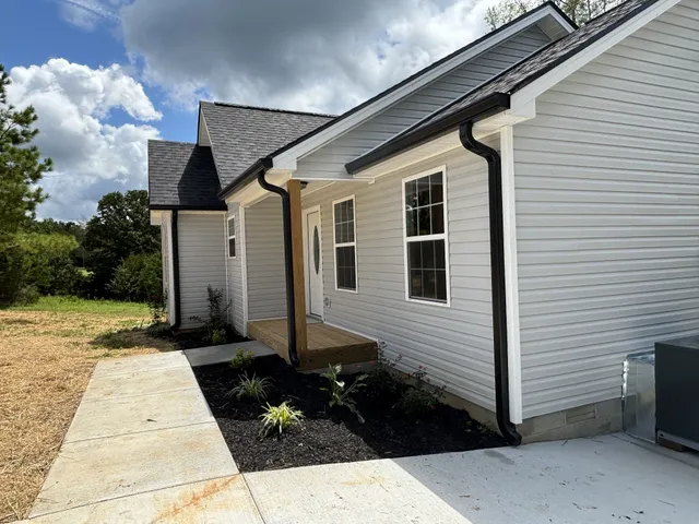 a front view of a house with street