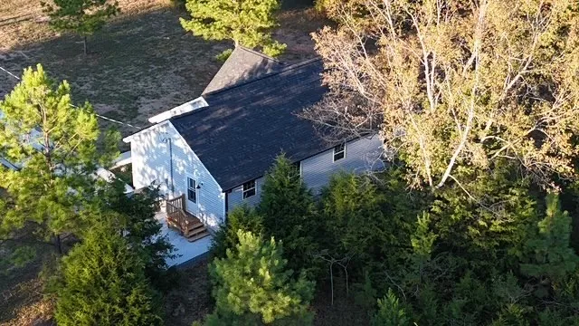 a view of a house with a tree
