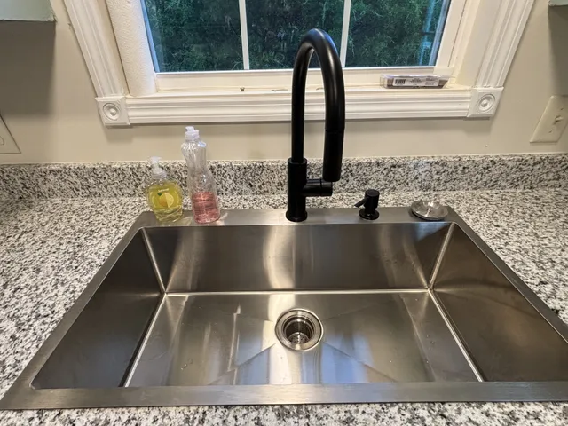 a view closeup of a sink and a window
