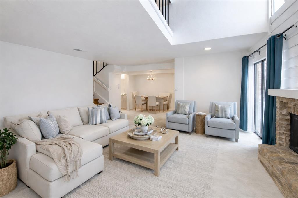 Vitually staged.Living room open to dining room.