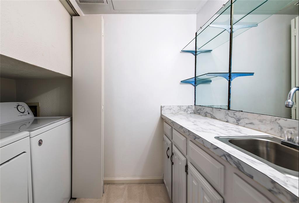 5626 Preston Oaks Road, Unit 5A Dallas, TX 75254 - Photo 11 of 20 Nook off dining room has enclosed washer dryer space and wet bar.