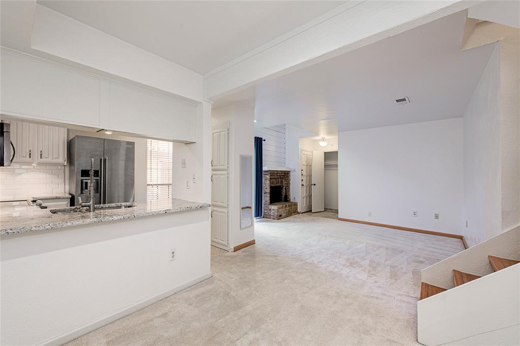 5626 Preston Oaks Road, Unit 5A Dallas, TX 75254 - Photo 15 of 20 Kitchen with breakfast bar, open to dining room.