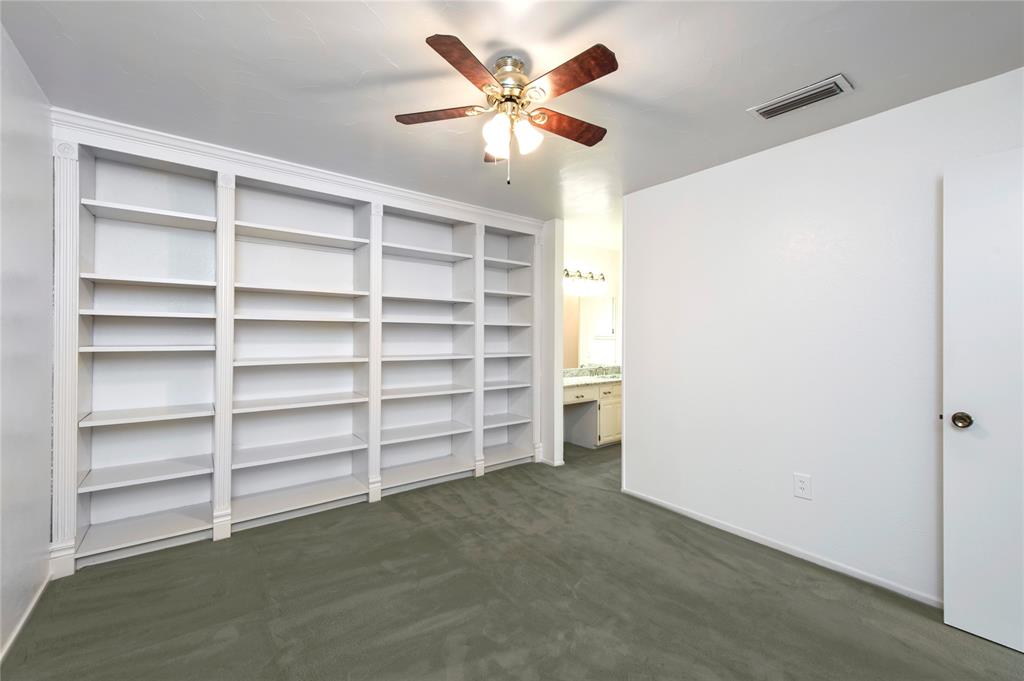 5626 Preston Oaks Road, Unit 5A Dallas, TX 75254 - Photo 17 of 20 Downstairs primary bedroom with ensuite bath.Could work well as a private study.