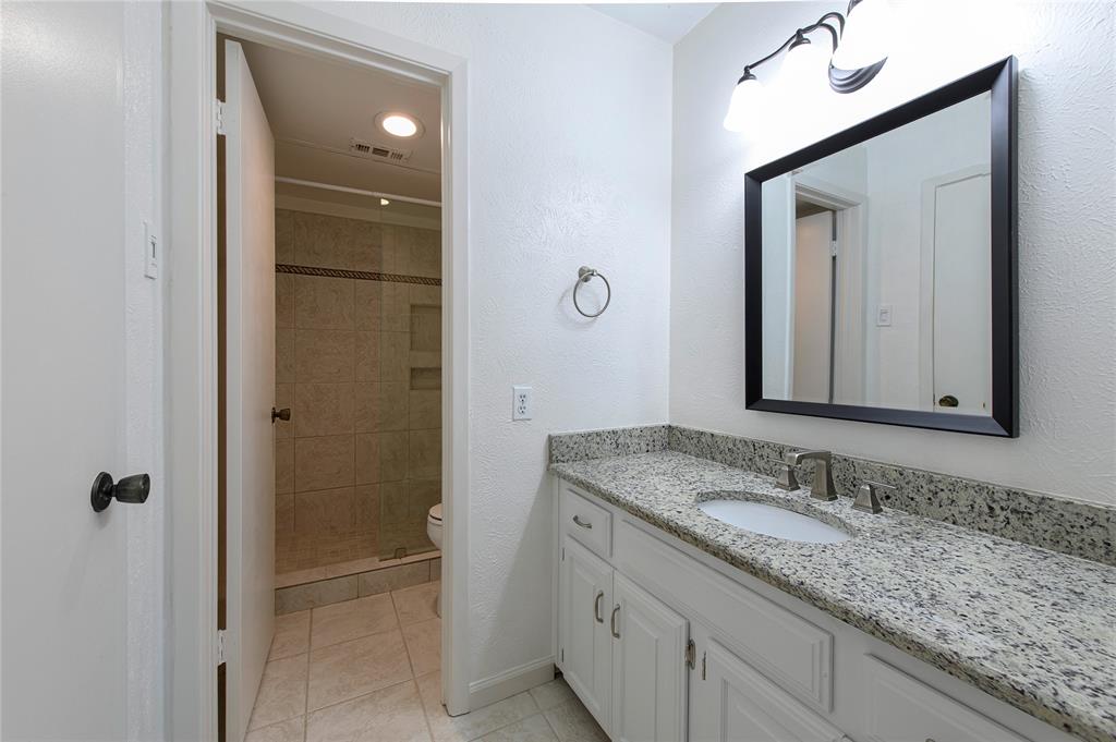 5626 Preston Oaks Road, Unit 5A Dallas, TX 75254 - Photo 10 of 20 Upstairs bath is en suite to second bedroom and also is accessible from upstairs living room