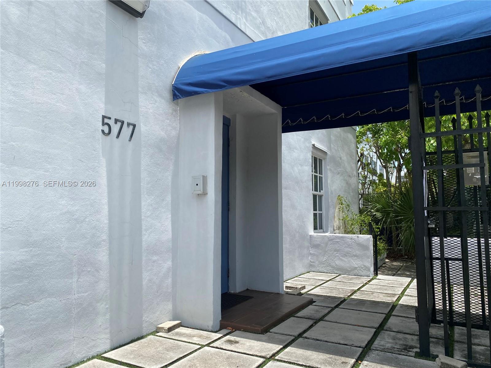 577 Northeast 62nd Street, Unit 8 Miami, FL 33138 - Photo 2 of 21 a view of a porch