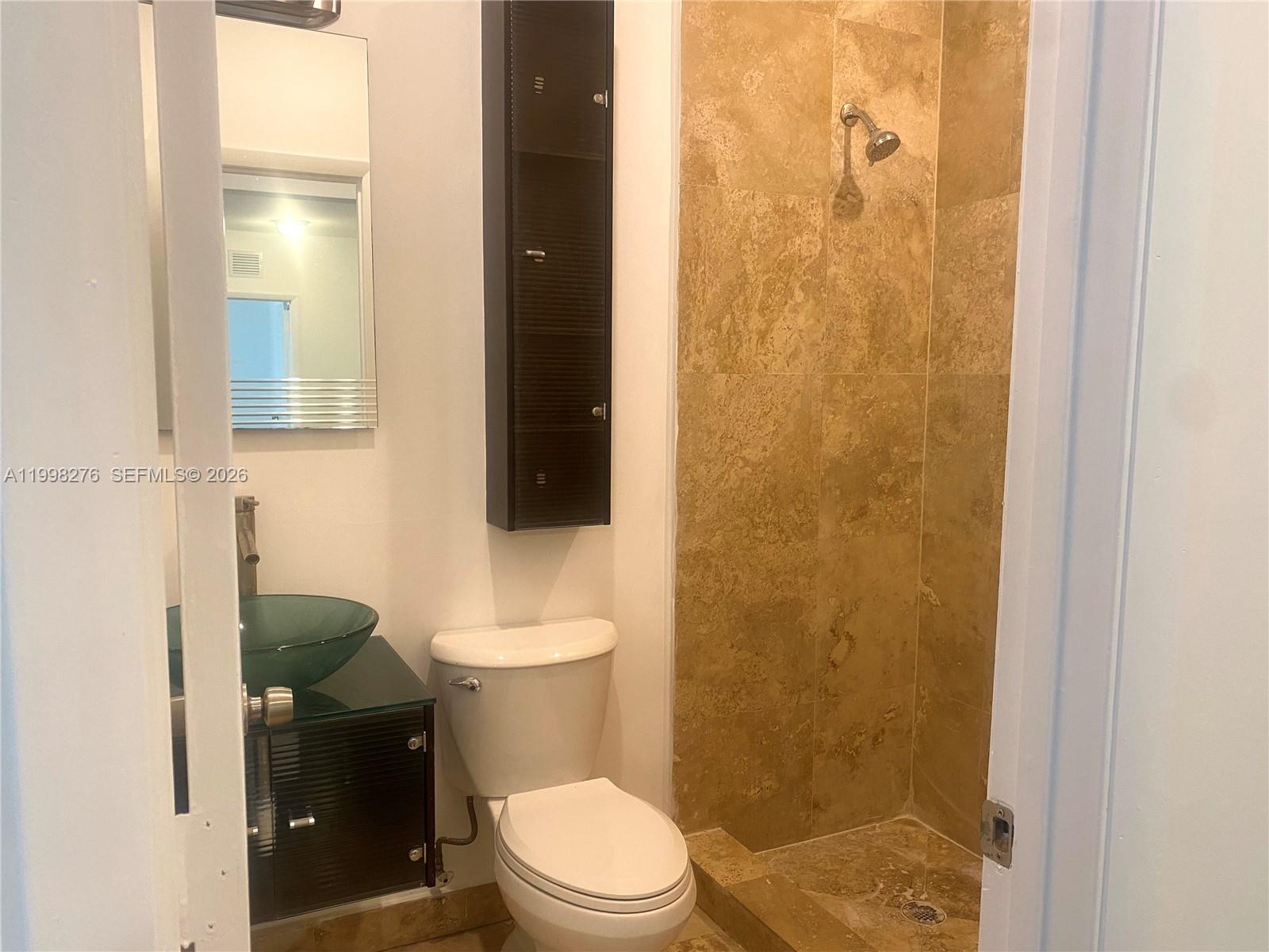 577 Northeast 62nd Street, Unit 8 Miami, FL 33138 - Photo 9 of 21 a bathroom with a toilet and a shower