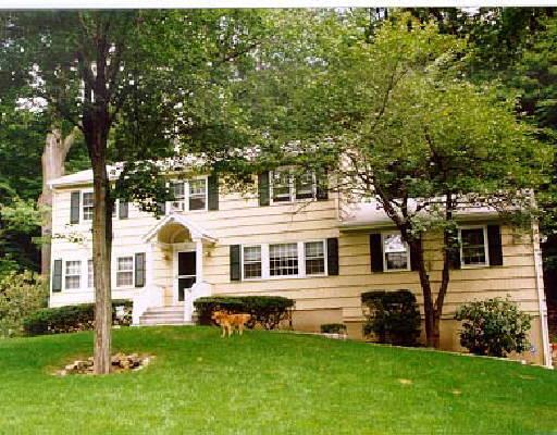 149 McIntosh Road Stamford, CT 06903 - Photo 1 of 1 a front view of a house with a yard
