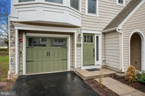 a front view of a house with a garage