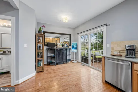 a view of a kitchen with furniture and a window