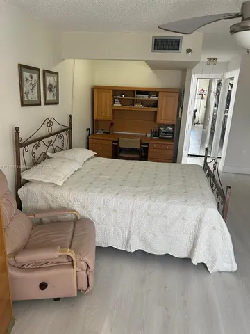 a bathroom with a shower and toilet