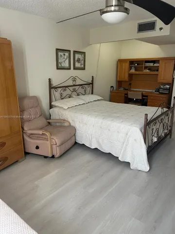 a view of a swimming pool with an outdoor seating