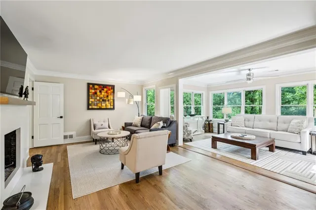a living room with furniture and a large window