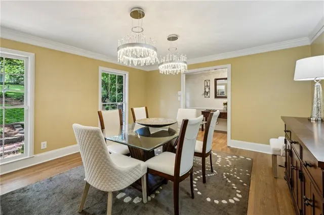 a view of a dining room with furniture window and wooden floor